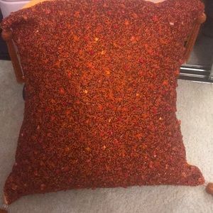 Embellished orange pillow